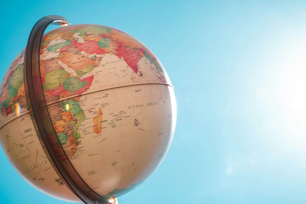 World globe against a blue sky, showing Africa and the Indian Ocean